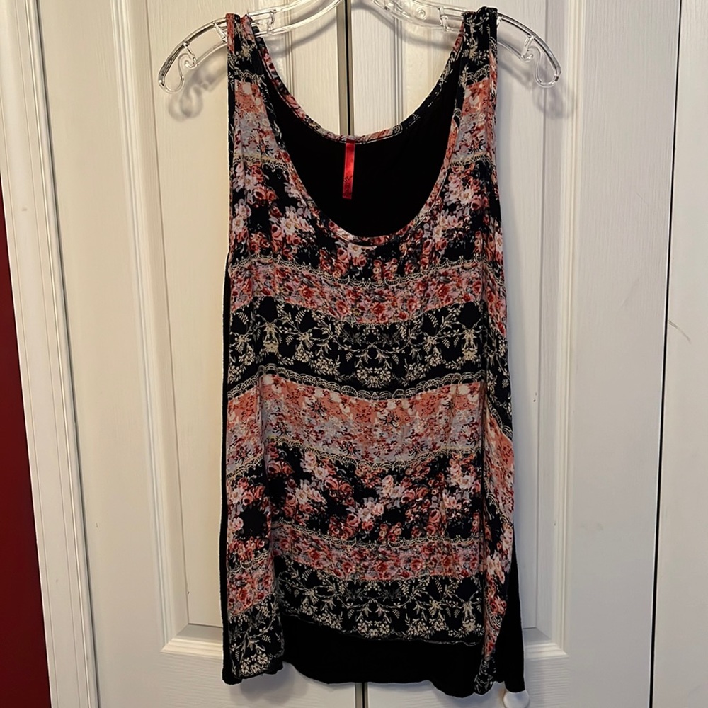 Sleeveless floral print top with solid black back